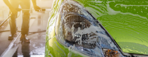 a green car in a car wash