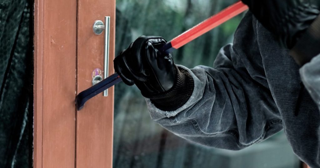 a burglar trying to access a locked door