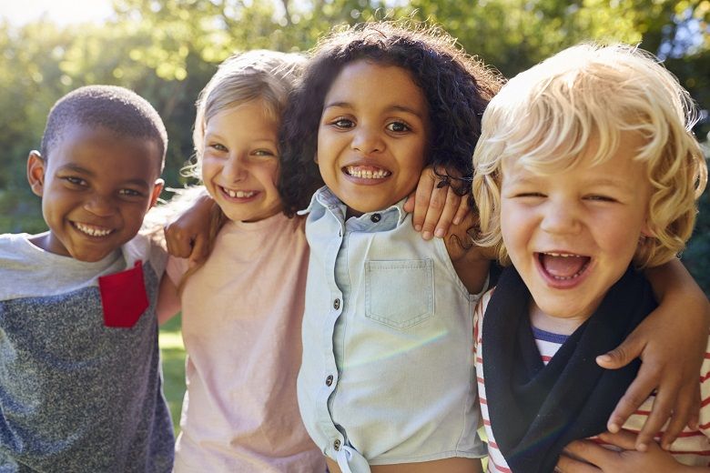 a banner with color children smilling